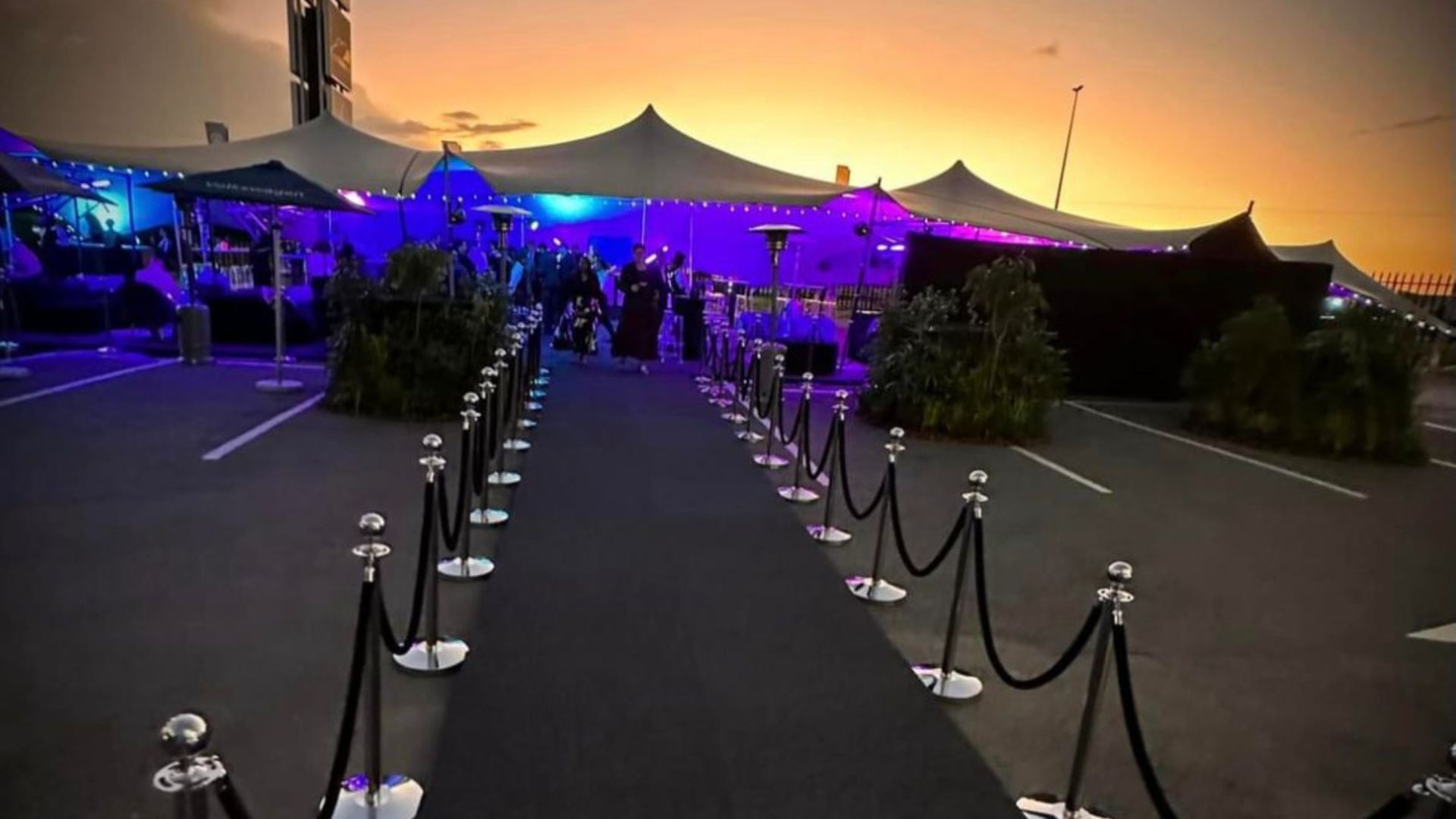 Product launch arrival experience with velvet rope entrance and sunset lighting in South Africa