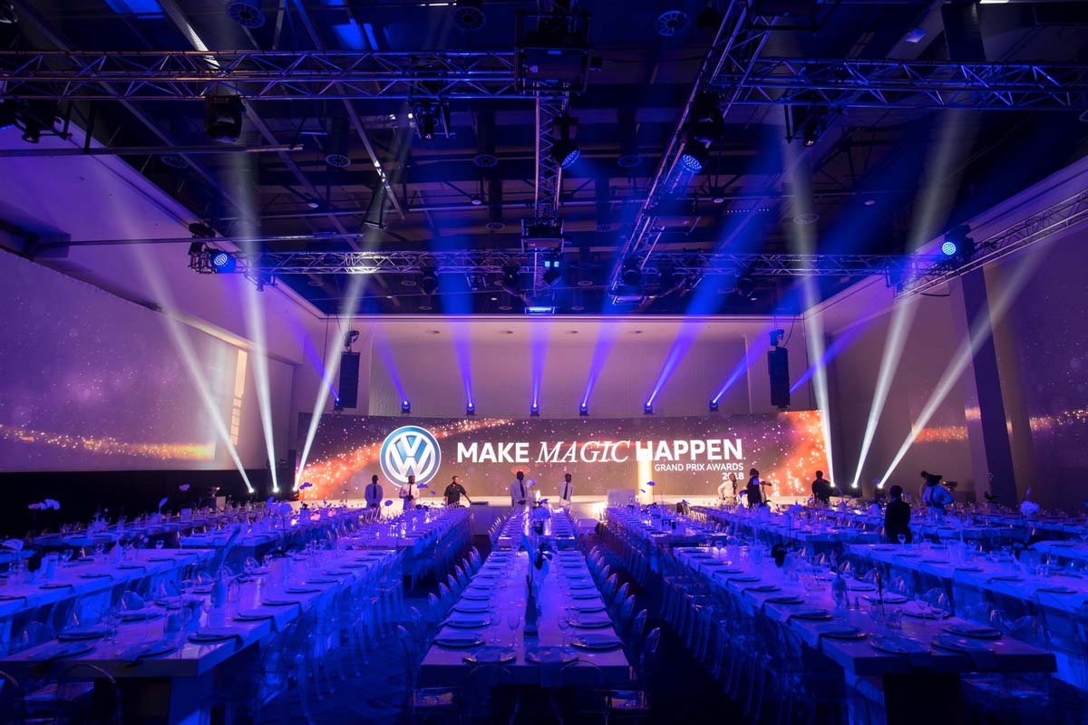Volkswagen gala dinner venue with styled banquet tables, stage lighting and corporate hospitality setup