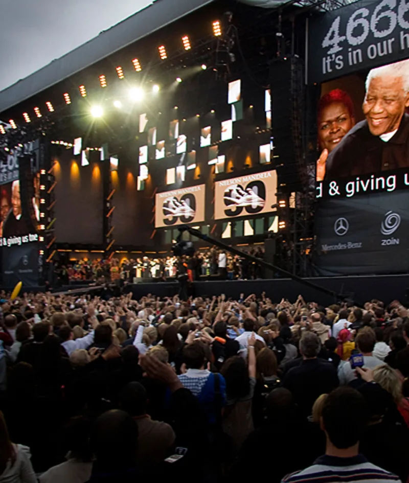 Global Citizen Mandela 100 concert stage framed by large screens and stadium production lighting