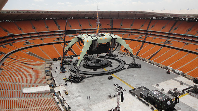 Empty large-scale concert stage before doors open with lighting rig, LED screens and audio system ready