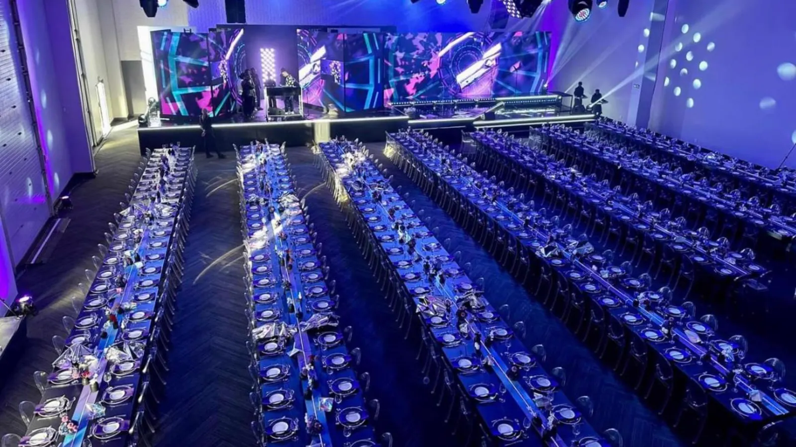 Mushroom Productions delivering large-scale corporate conference production with LED stage backdrop, premium banquet settings and full production lighting